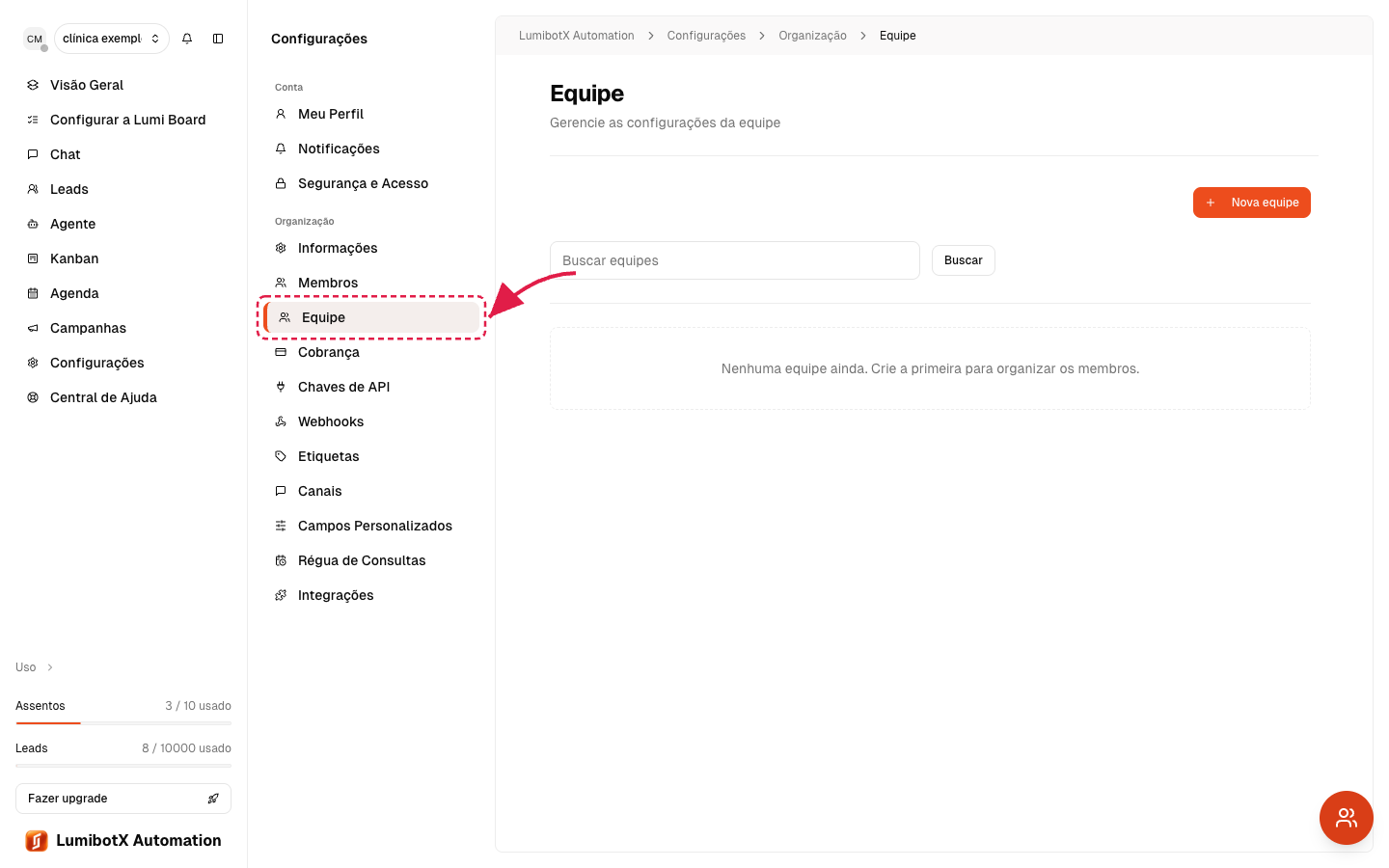 Menu de Configurações aberto com seta vermelha apontando para o item Equipe dentro de Organização
